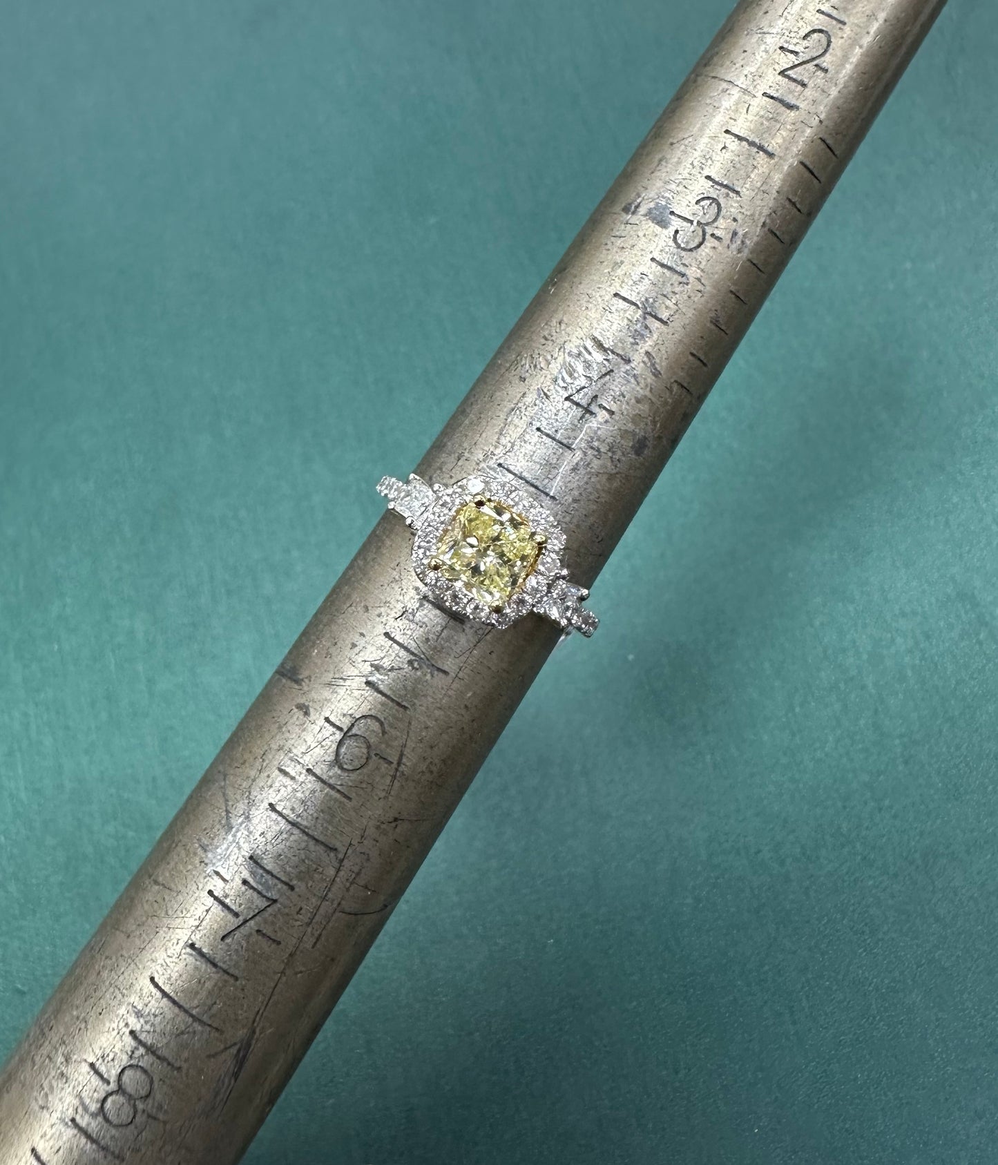 Three stone princess cut yellow diamond ring