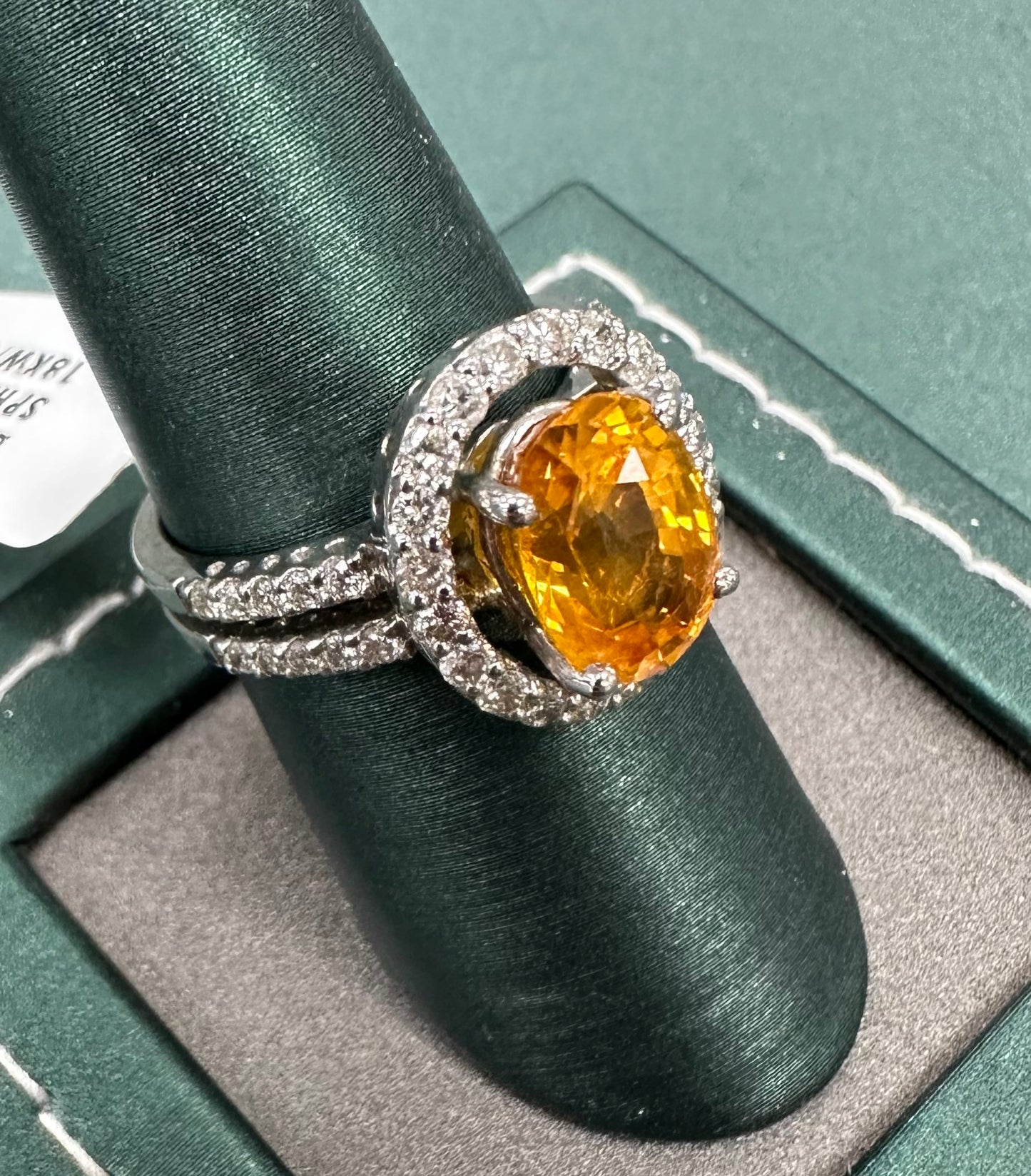 The orange sapphire sun diamond ring