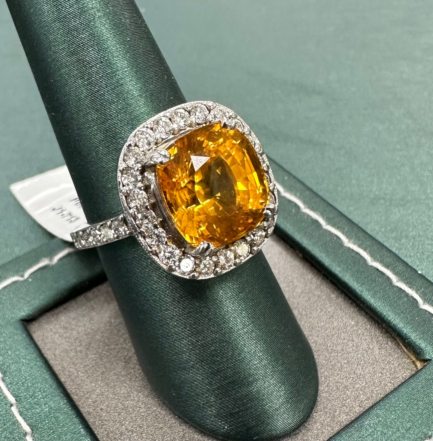 The orange sapphire sun diamond ring