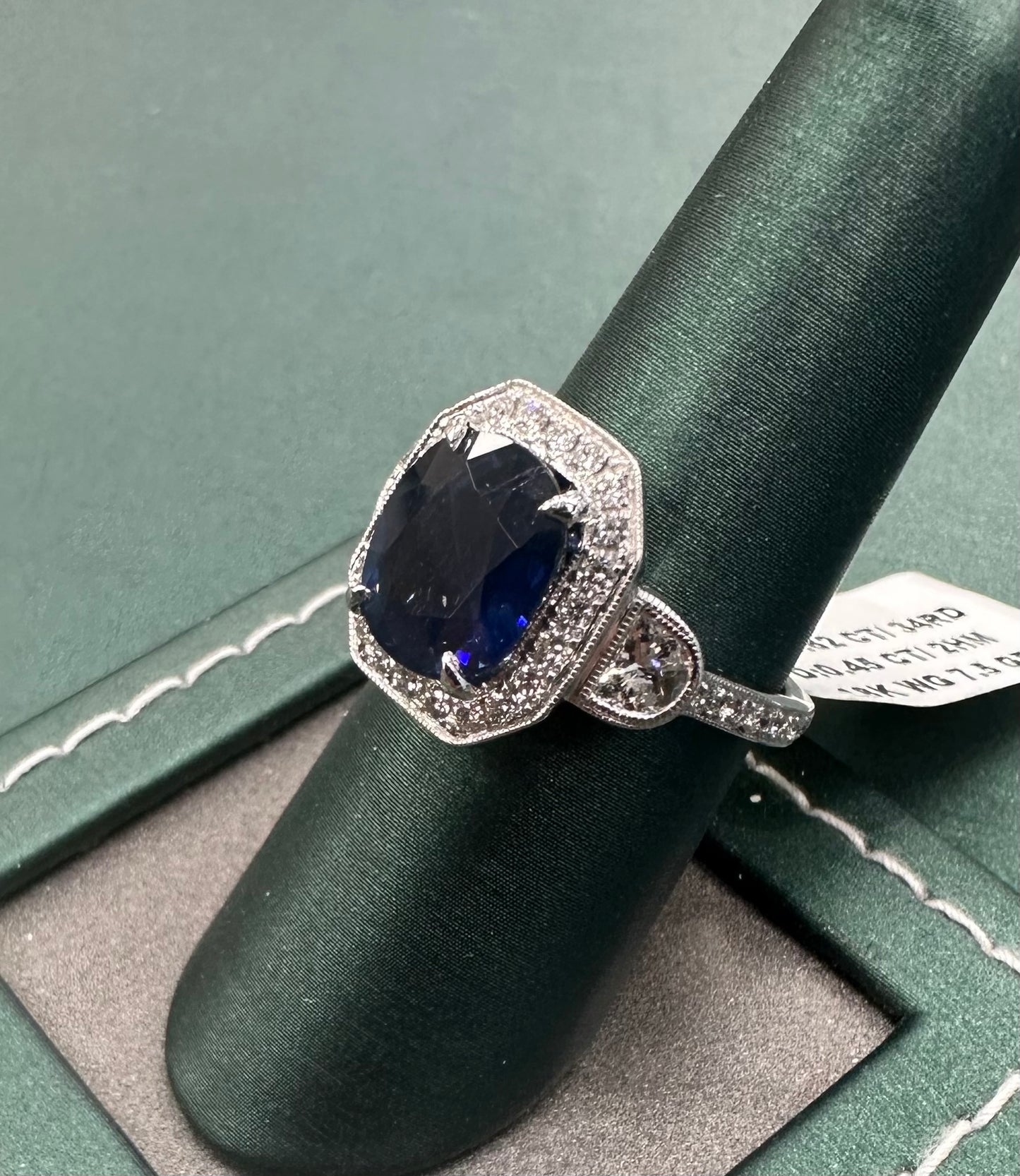 Queens three stone sapphire and diamond ring