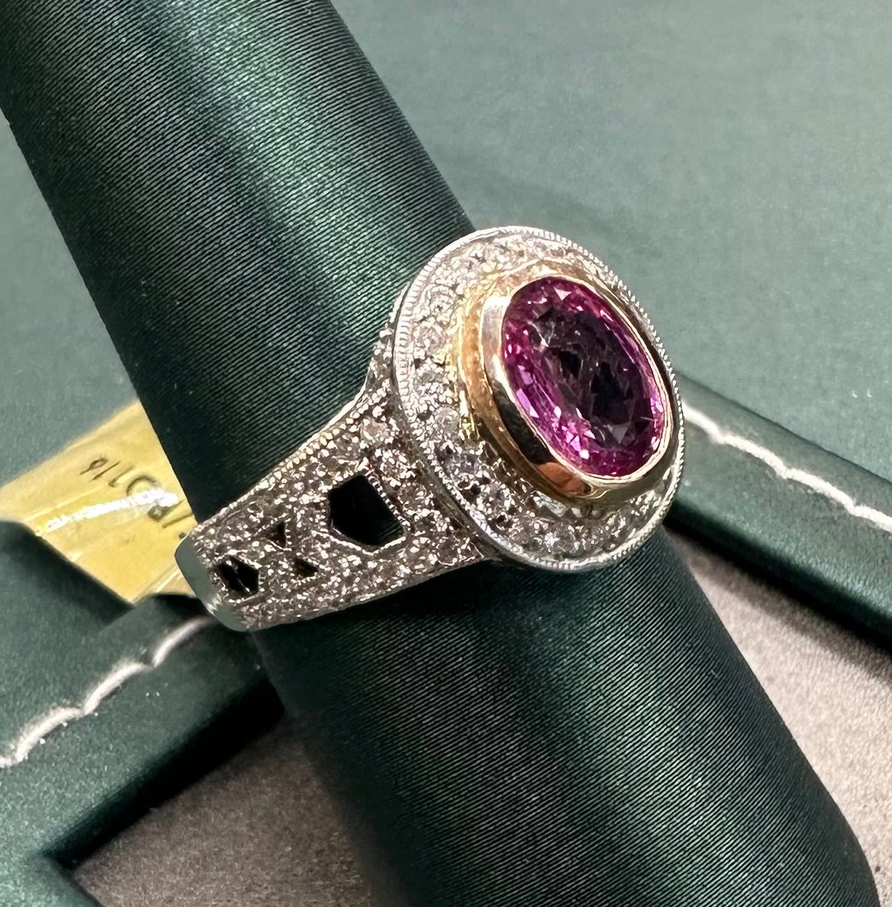 Oval pink sapphire halo ring
