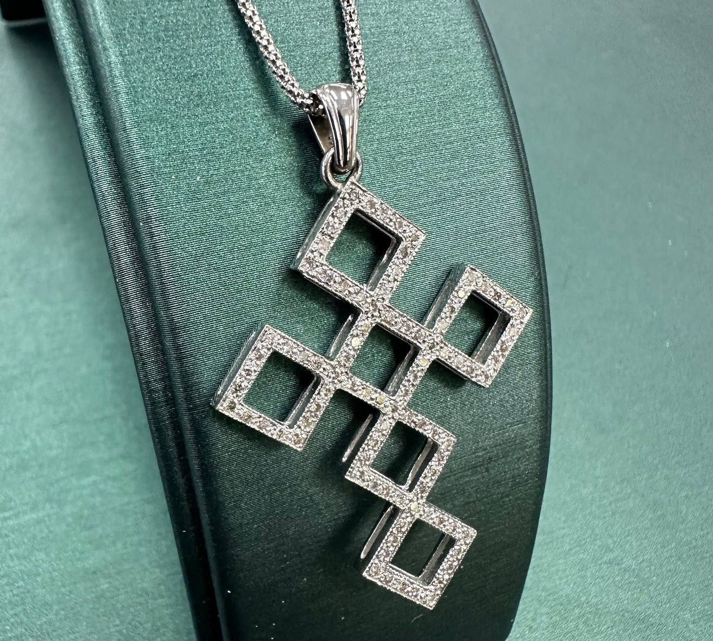 Diamond shape cross pendant