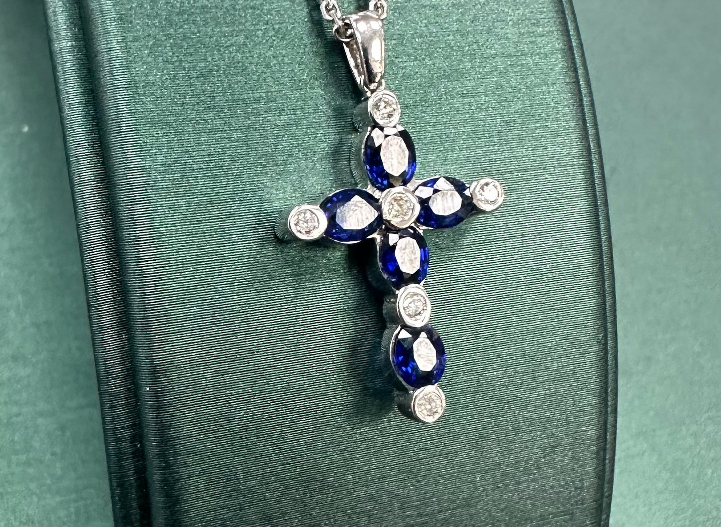Diamond and sapphire dotted cross pendant