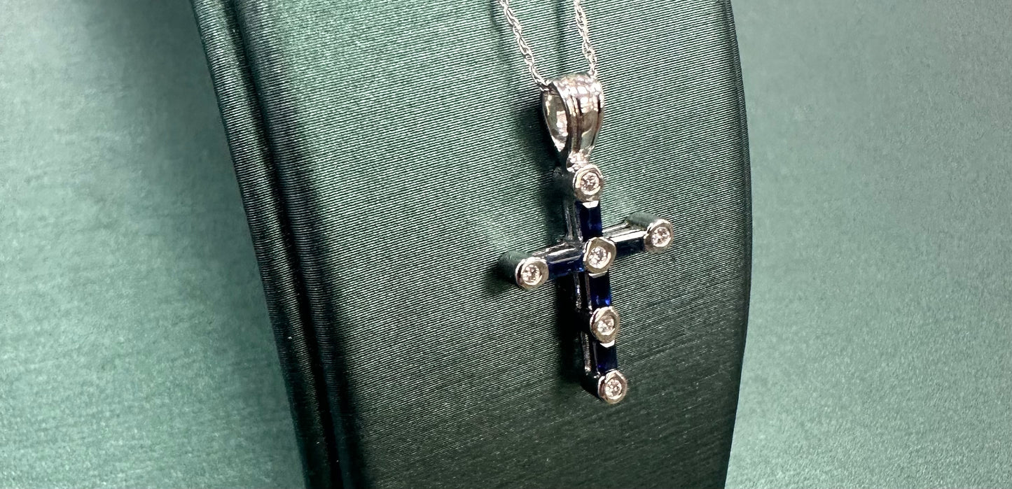 Dotted diamond and blue sapphire cross pendant