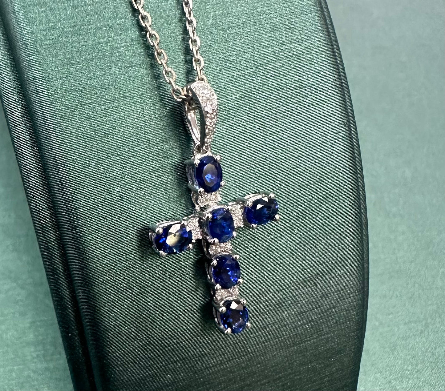 Oval blue sapphire and diamond cross pendant