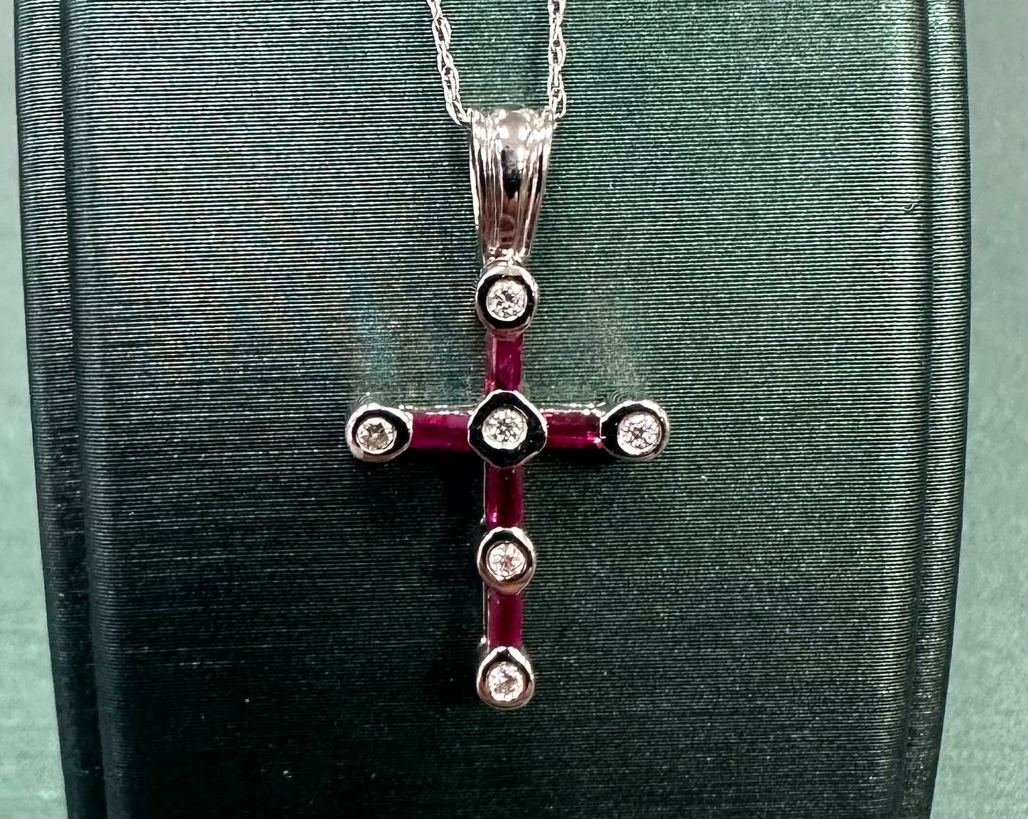 Rotted ruby and diamond cross pendant