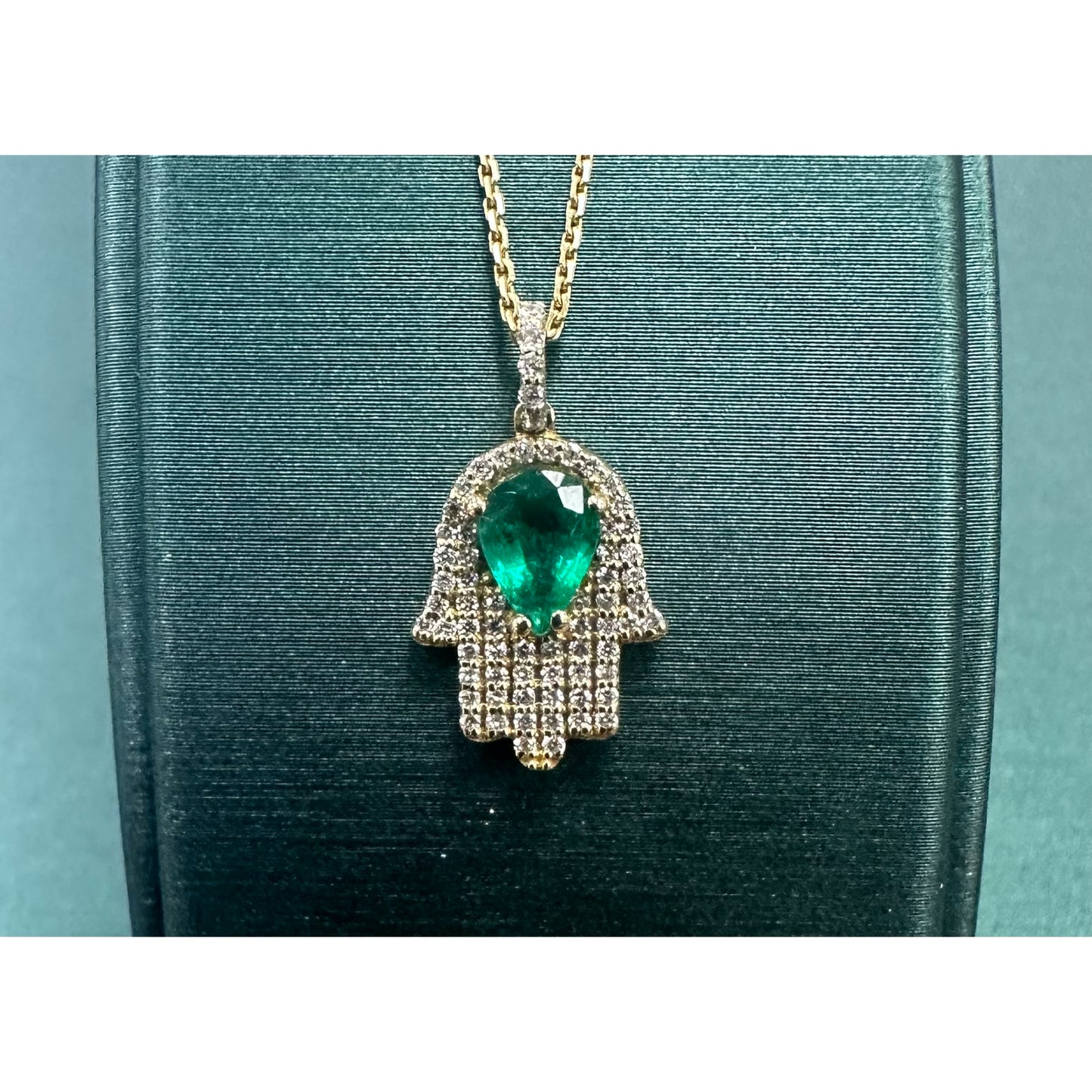 Pear emerald 7 diamond hamsa hand necklace