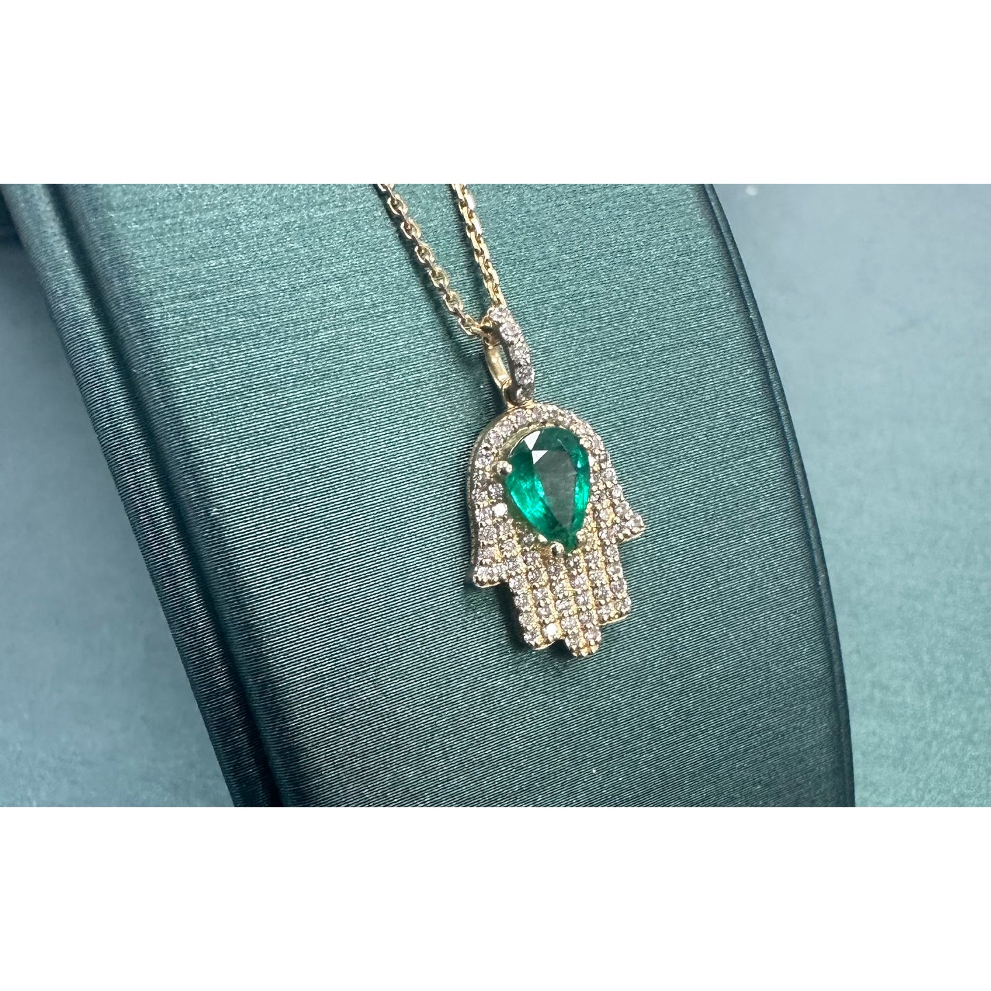 Pear emerald 7 diamond hamsa hand necklace