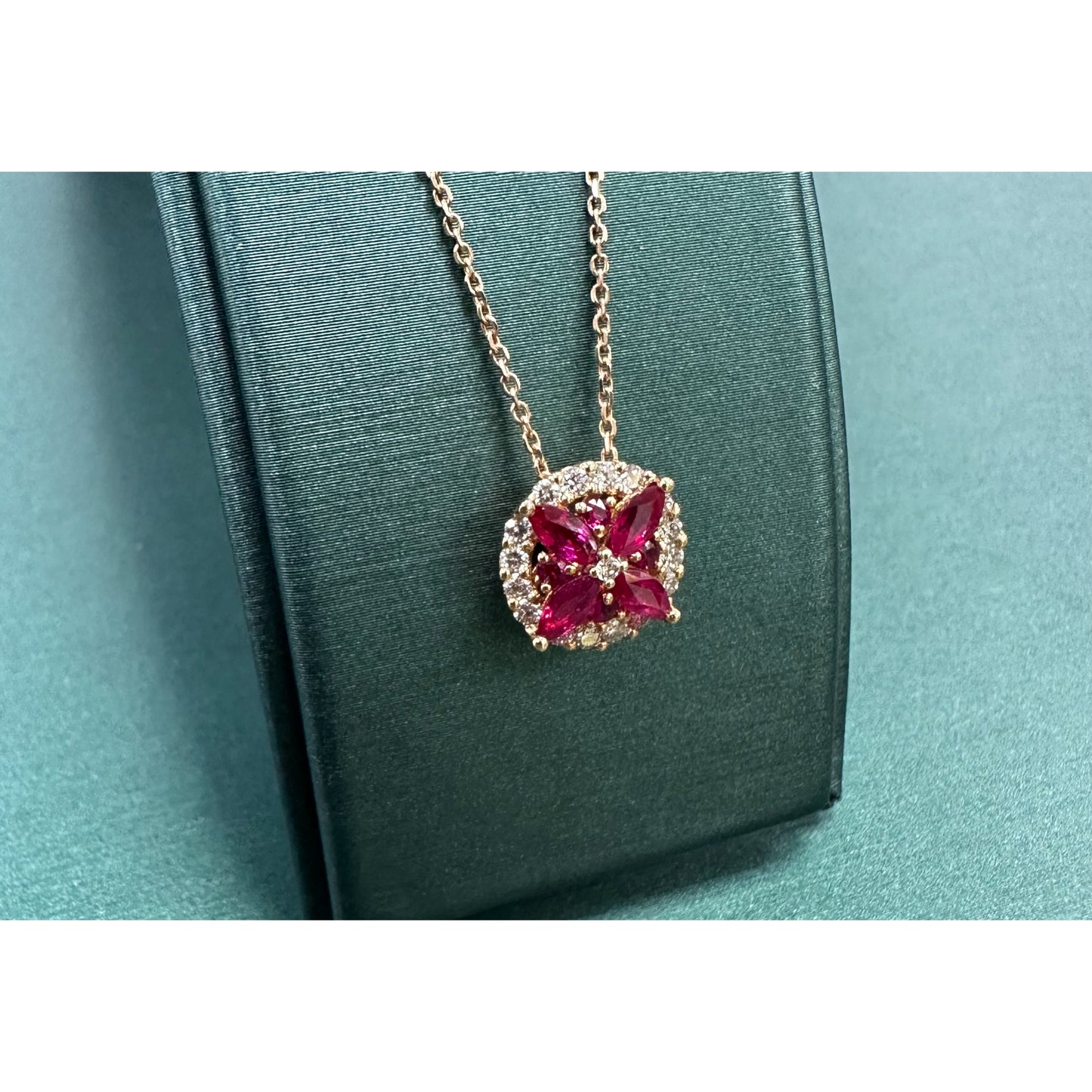 Ruby flower and diamond halo necklace