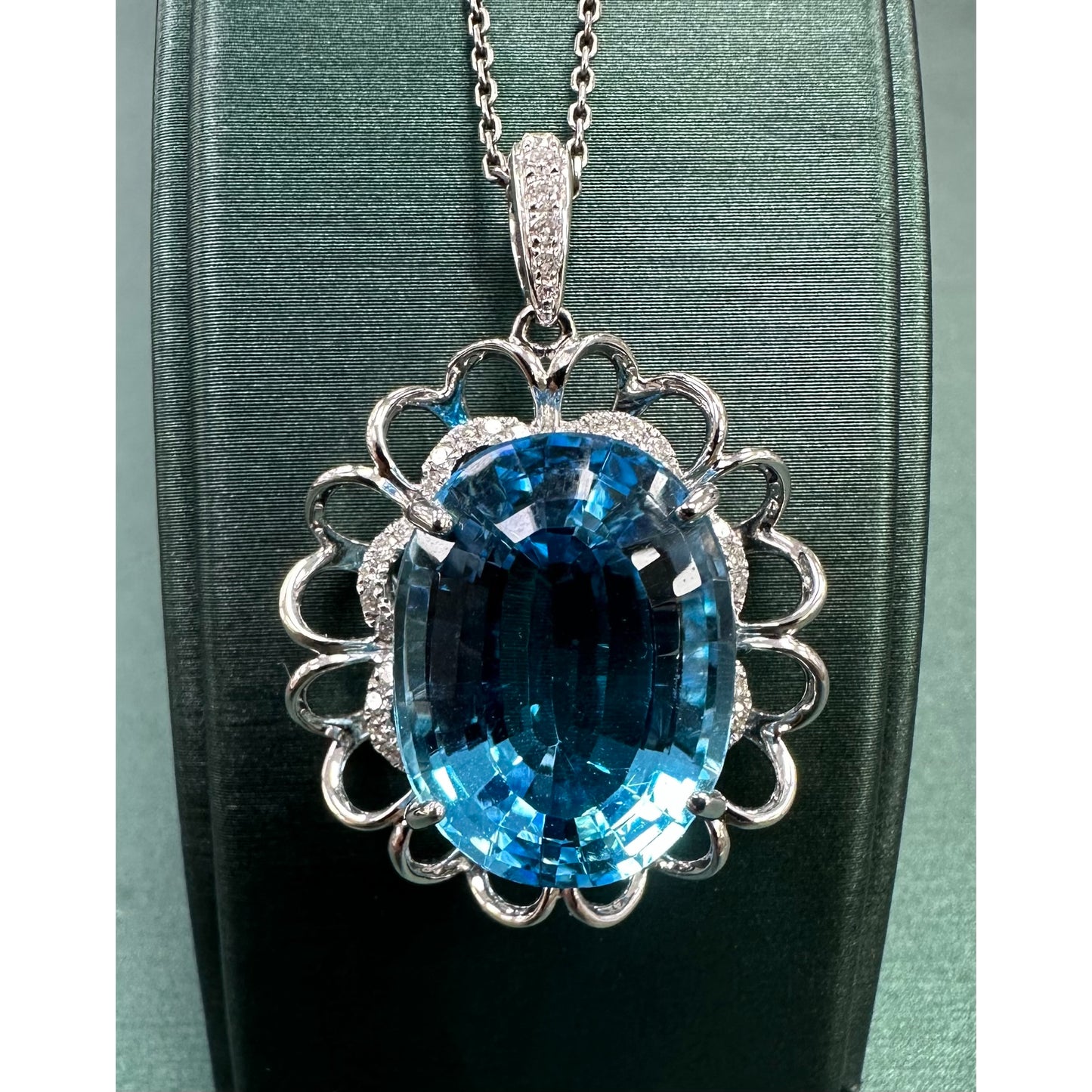 Oval shaped Swiss blue  Topaz Diamond mega halo necklace