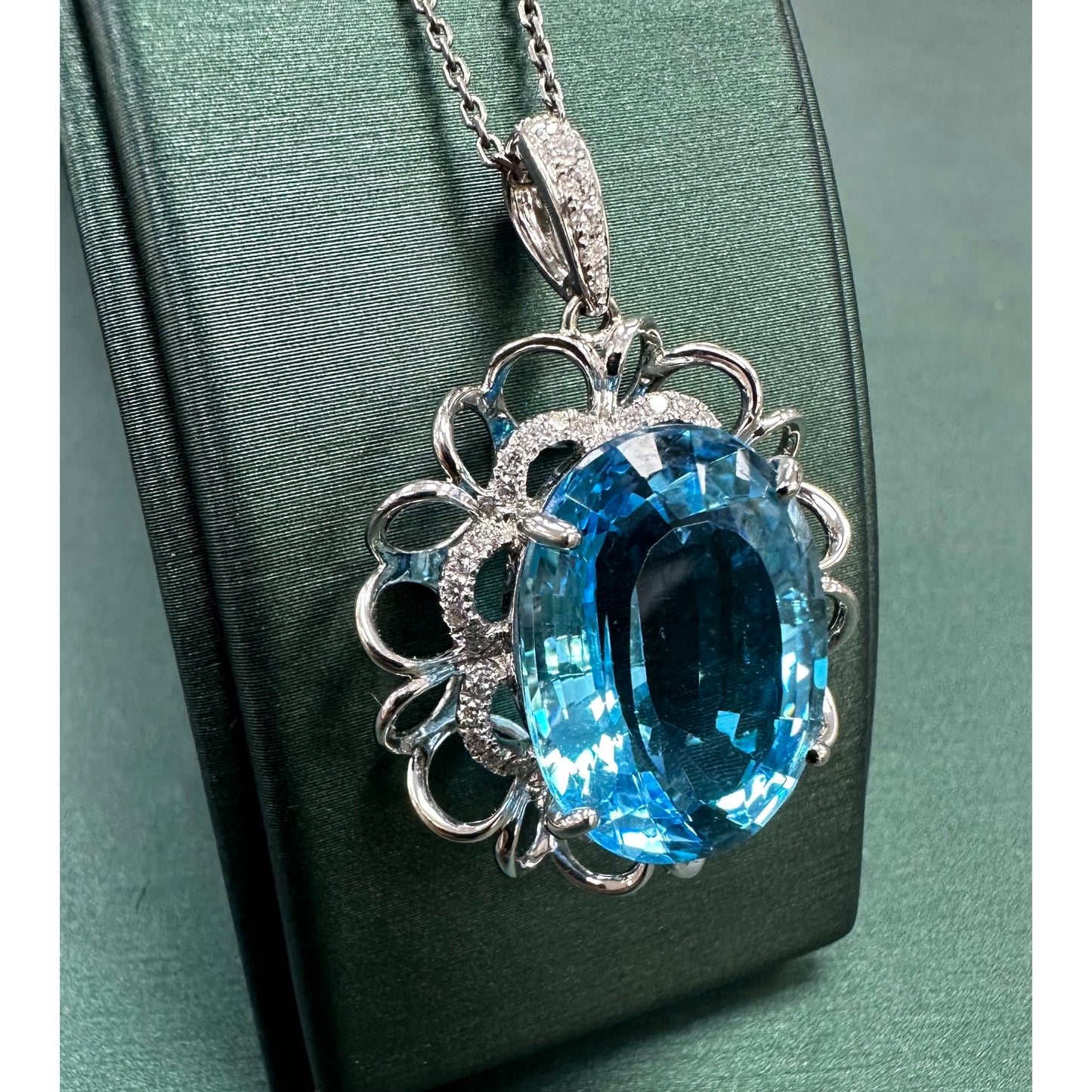 Oval shaped Swiss blue  Topaz Diamond mega halo necklace