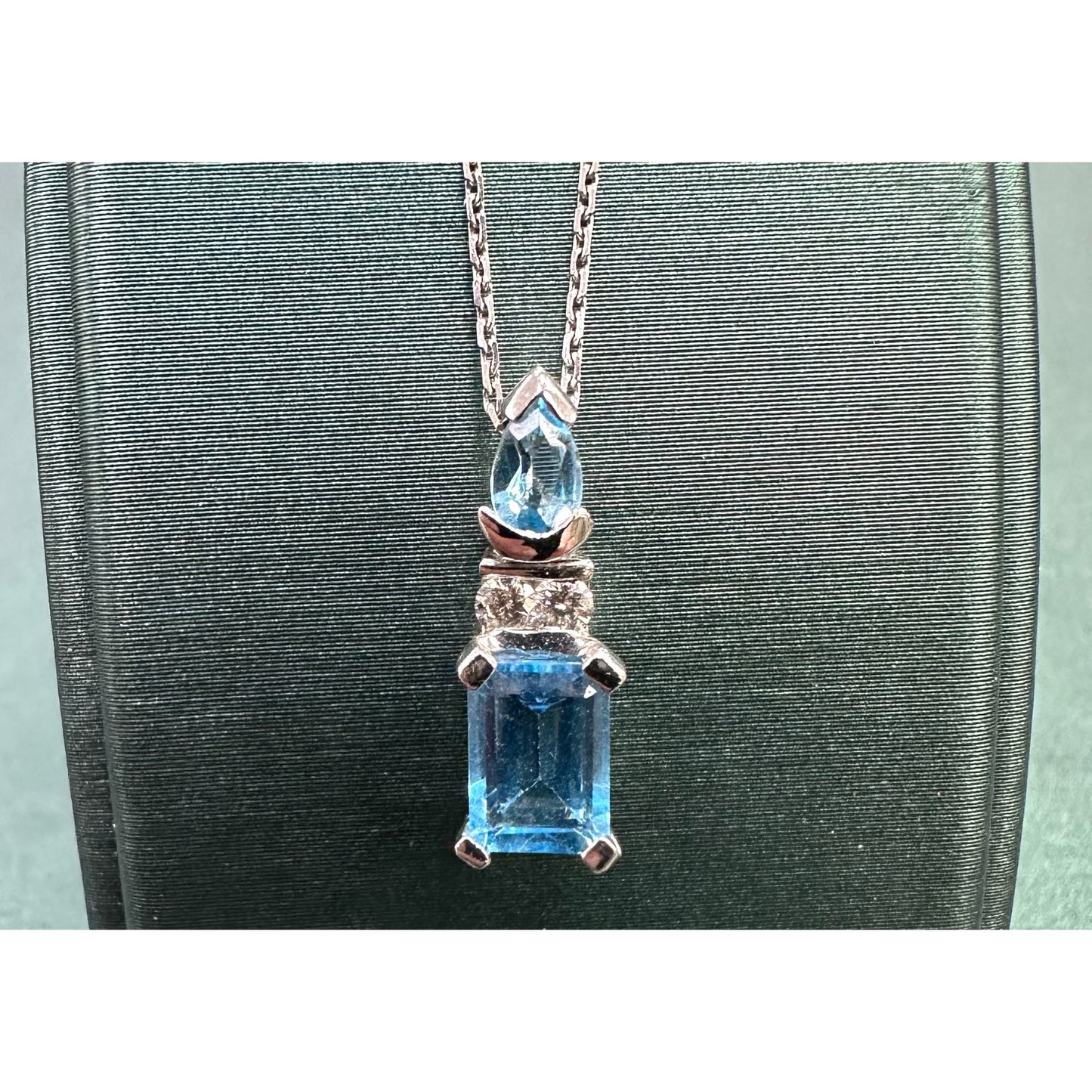Swiss blue topaz emerald cut dangle diamond necklace