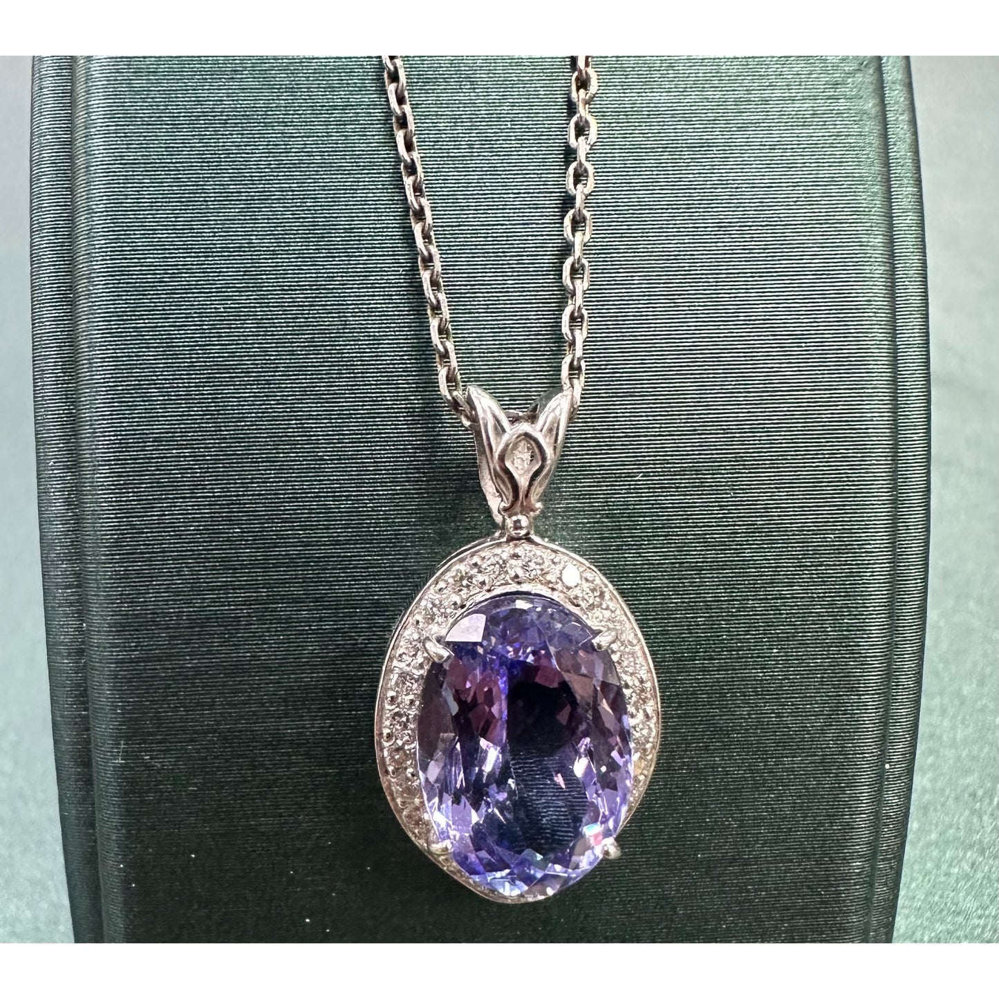 Large purple tanzanite 7 diamond halo necklace