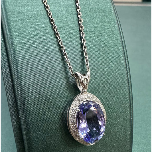 Large purple tanzanite 7 diamond halo necklace
